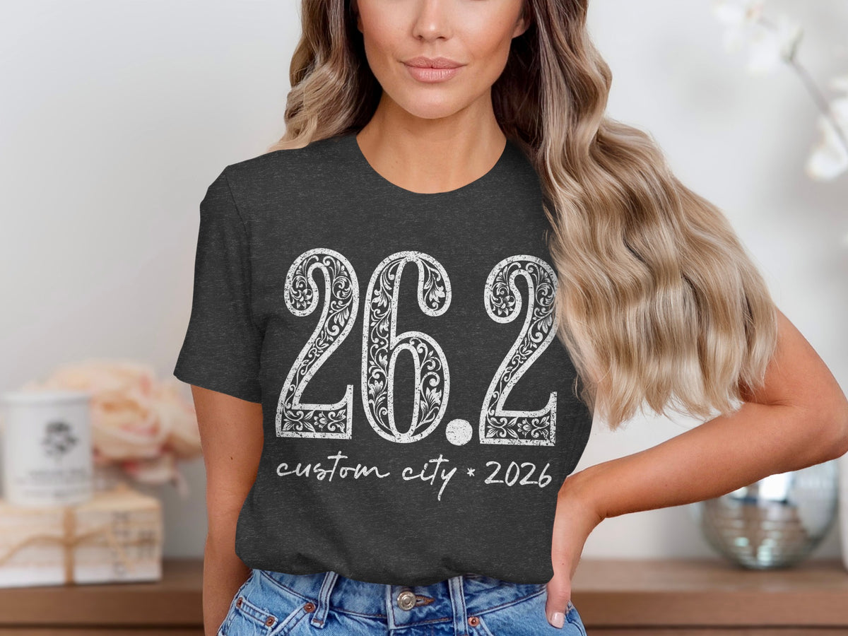 Dark grey t-shirt with white text "26.2 custom city * 2026".