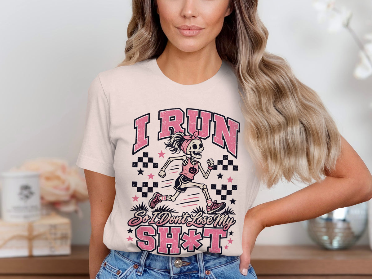 T-shirt with skeleton runner graphic and text "I RUN So I Don't Lose My SH*T".