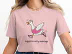 Pink t-shirt with cartoon goose running, text "aggressively average"