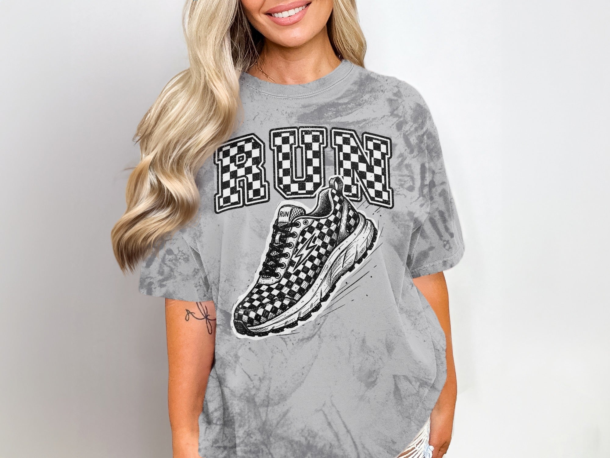 Grey tie-dye t-shirt with checkered "RUN" text and a checkered shoe graphic.