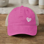 Pink trucker hat with white "run" heart graphic on the front.
