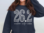 Navy sweatshirt with white "26.2 custom city * 2026" text in decorative font.
