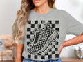 Grey t-shirt with checkered design, running shoe, and text "Never mess with a girl who runs marathons for fun".