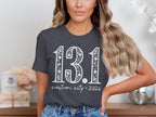Dark grey t-shirt with "13.1 custom city * 2026" printed in white.