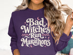 Purple sweatshirt with "Bad Witches Run Marathons" in distressed white lettering.