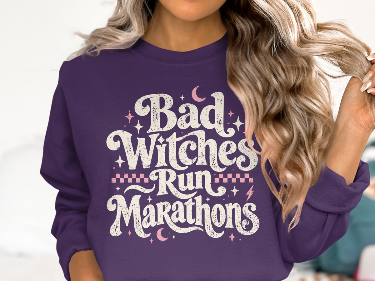 Purple sweatshirt with "Bad Witches Run Marathons" in distressed white lettering.