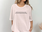 White t-shirt with text: "i have the kind of trauma where doing hard things feels like healing"