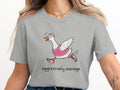 Grey t-shirt with cartoon goose running and text "aggressively average".