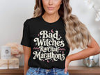 Black t-shirt with white text that reads "Bad Witches Run Half Marathons."