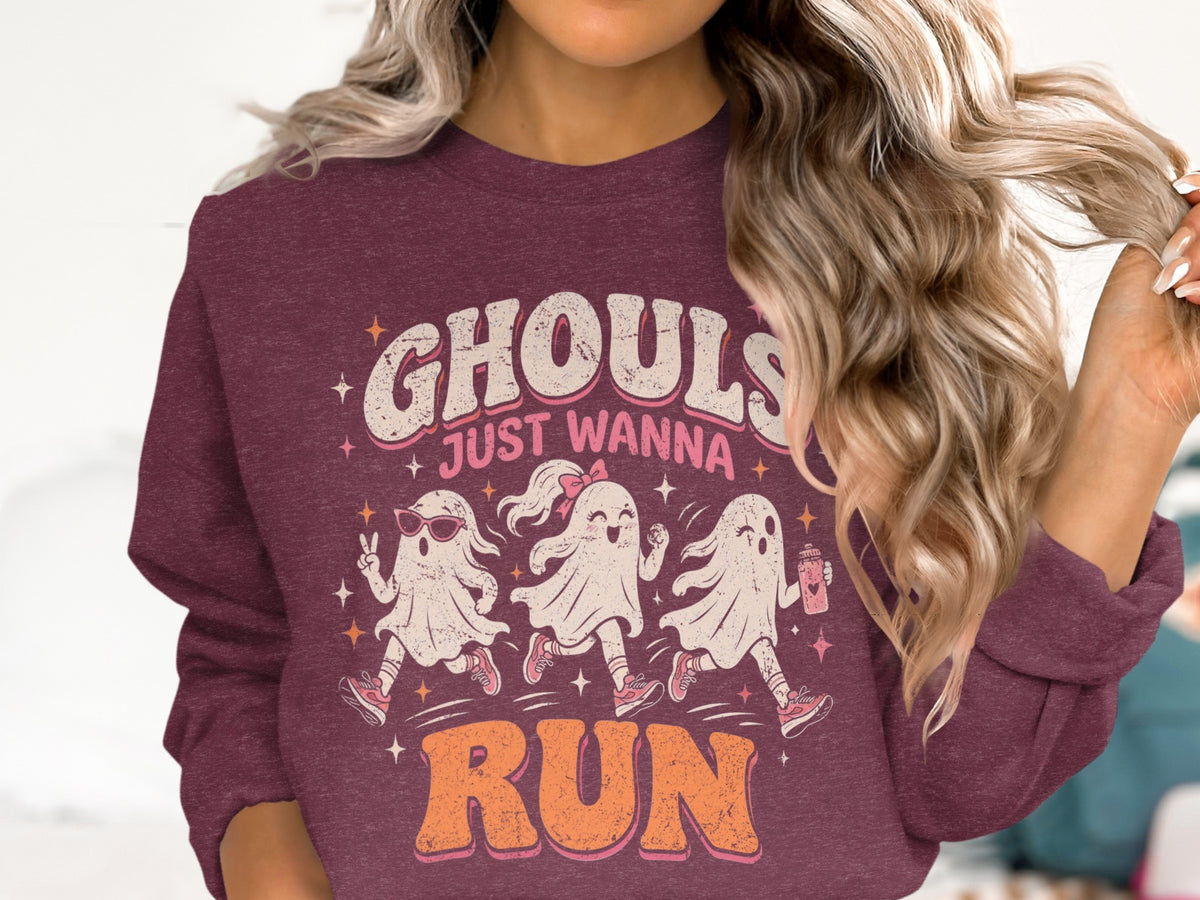 Maroon sweatshirt with "Ghouls Just Wanna Run" text and three cartoon ghosts running.