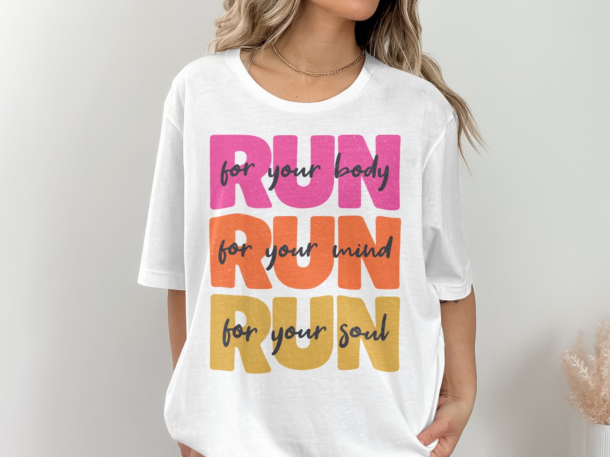 White t-shirt with "RUN for your body, mind, and soul" text.