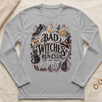 Gray long-sleeve shirt with "Bad Witches Run Club" graphic featuring a cat, cauldron, and crystals.