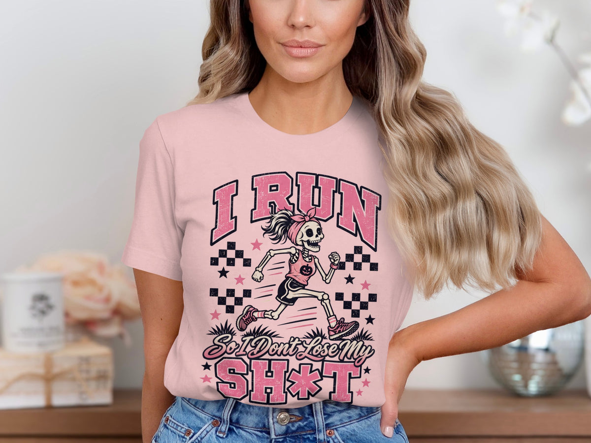 Skeleton runner graphic with text "I RUN So I Don't Lose My SH*T" on pink shirt.