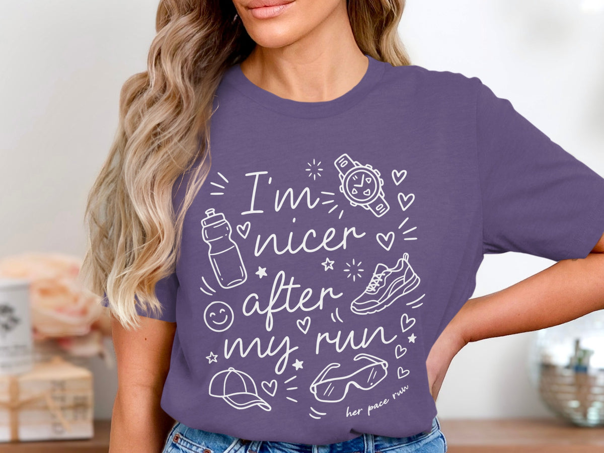 Purple t-shirt with white graphic "I'm nicer after my run" and running icons.