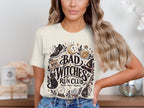 Graphic tee with "Bad Witches Run Club" text and witchy icons.