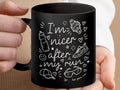 Black mug with white running-themed doodles and "I'm nicer after my run" text.