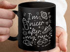 Black mug with white running-themed doodles and "I'm nicer after my run" text.