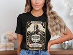 Black t-shirt with "DELUSION ELIXIR" bottle design and "13.1 sounds fun" warning.