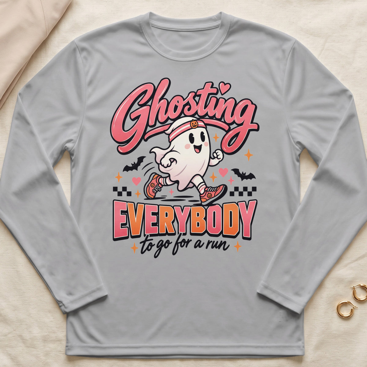 Grey long-sleeve shirt with a cartoon ghost running and text "Ghosting Everybody to go for a run."