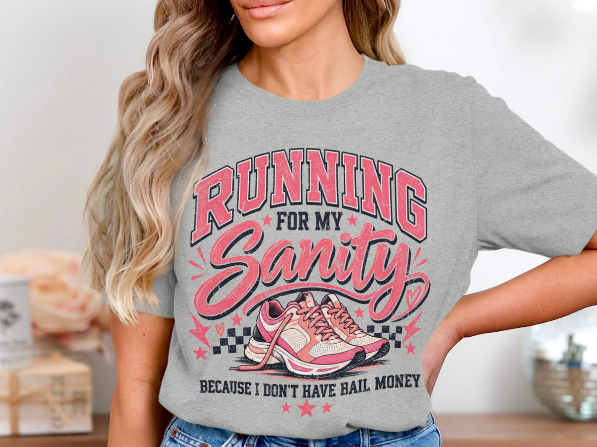 Gray t-shirt with text "RUNNING FOR MY Sanity BECAUSE I DON'T HAVE BAIL MONEY" and pink running shoes.
