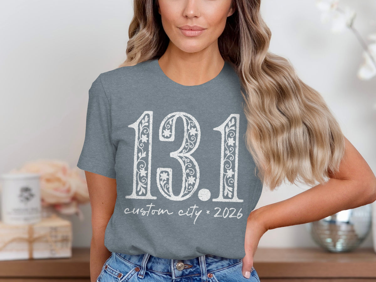 Gray t-shirt with white "13.1 custom city * 2026" text.