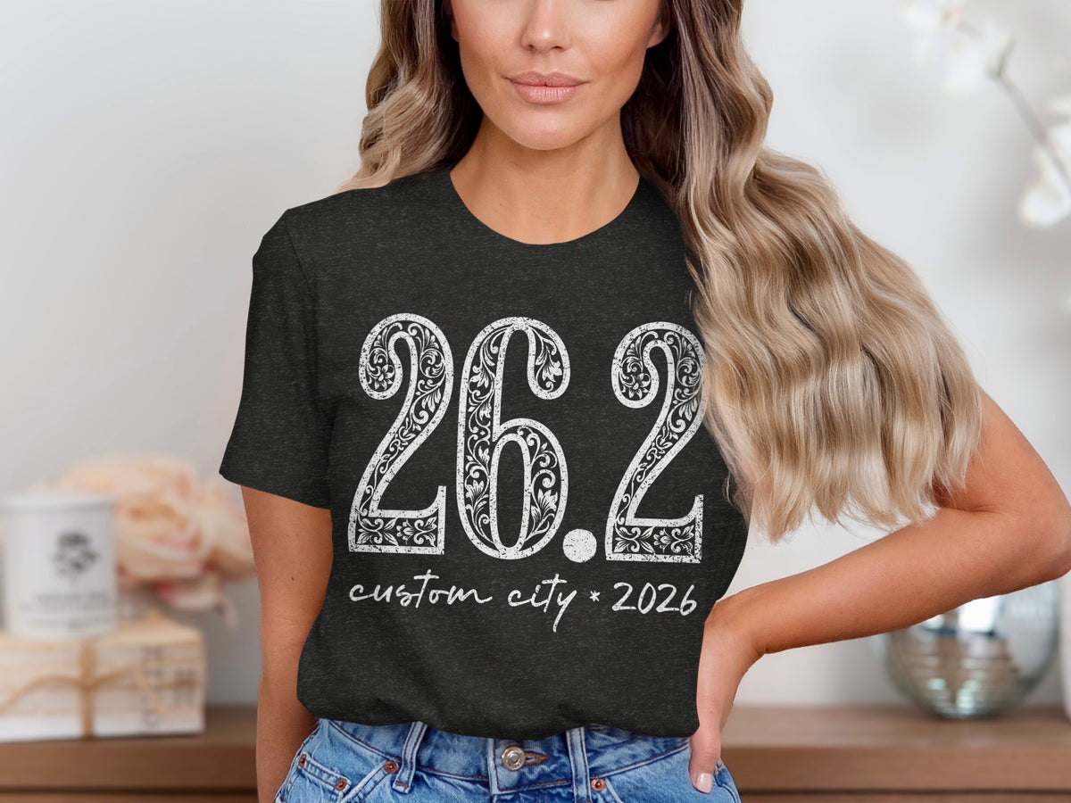 Dark grey t-shirt with white text "26.2 custom city * 2026".