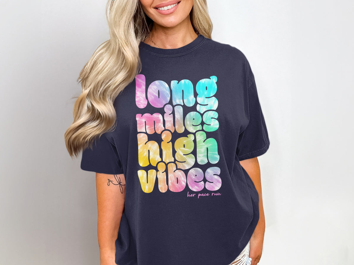 Dark blue t-shirt with "long miles high vibes" in tie-dye letters.