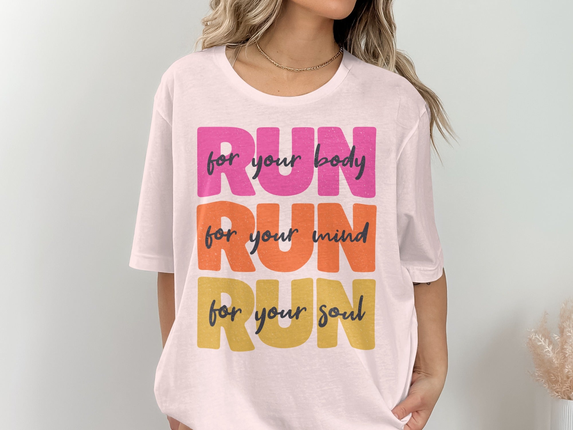 White t-shirt with "RUN for your body, RUN for your mind, RUN for your soul" text.