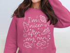 Pink sweatshirt with "I'm nicer after my run" graphic and running icons.