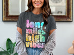 Charcoal t-shirt with tie-dye text reading "long miles high vibes."