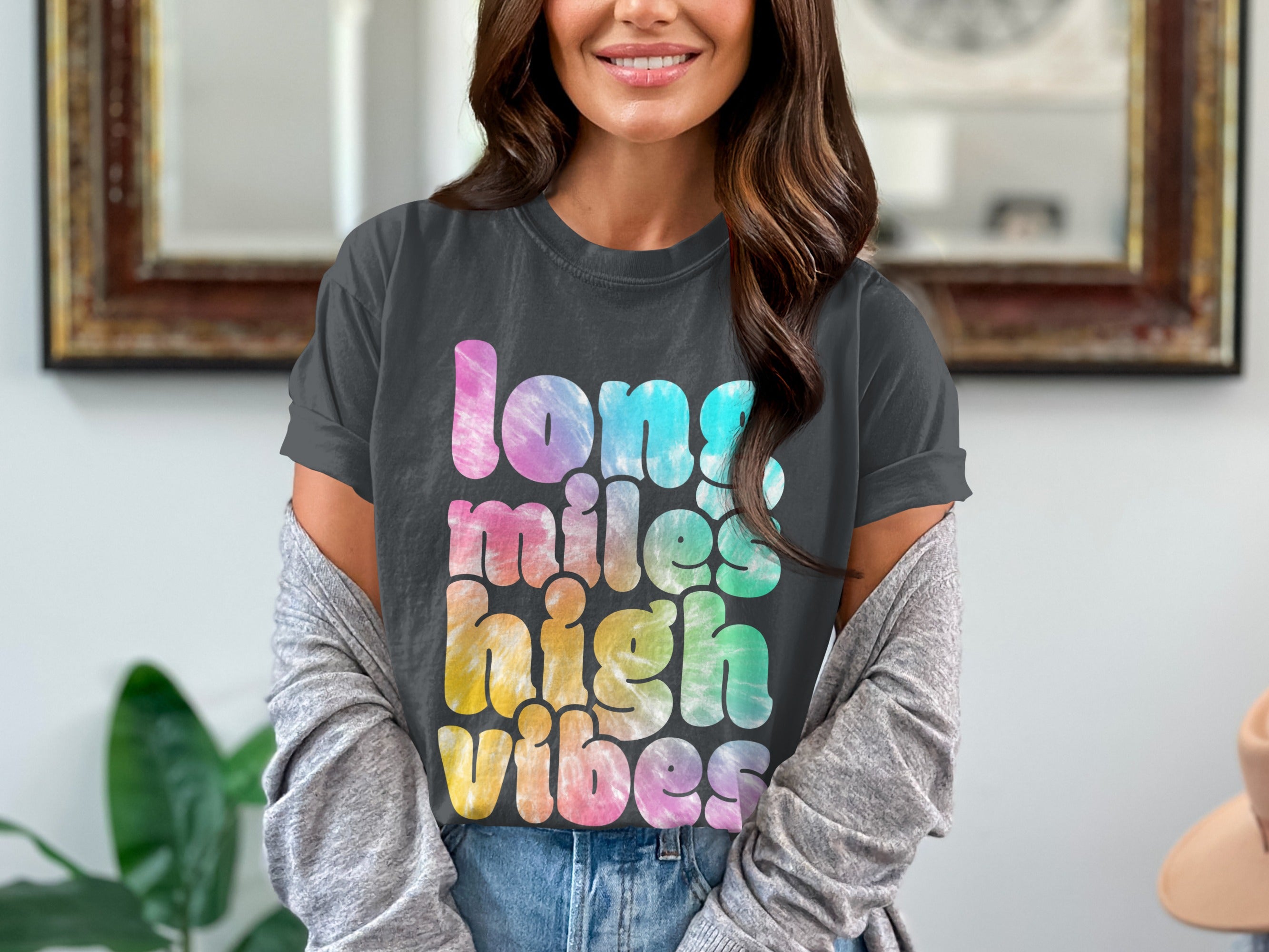 Charcoal t-shirt with tie-dye text reading "long miles high vibes."