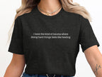 Dark t-shirt with text "i have the kind of trauma where doing hard things feels like healing".