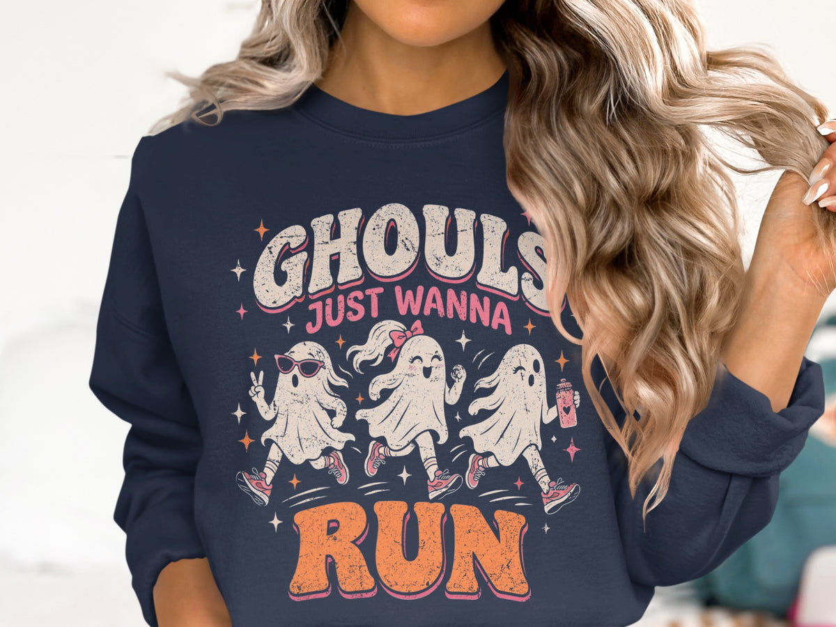 "Ghouls just wanna run" text with three cartoon ghosts running on navy sweatshirt.