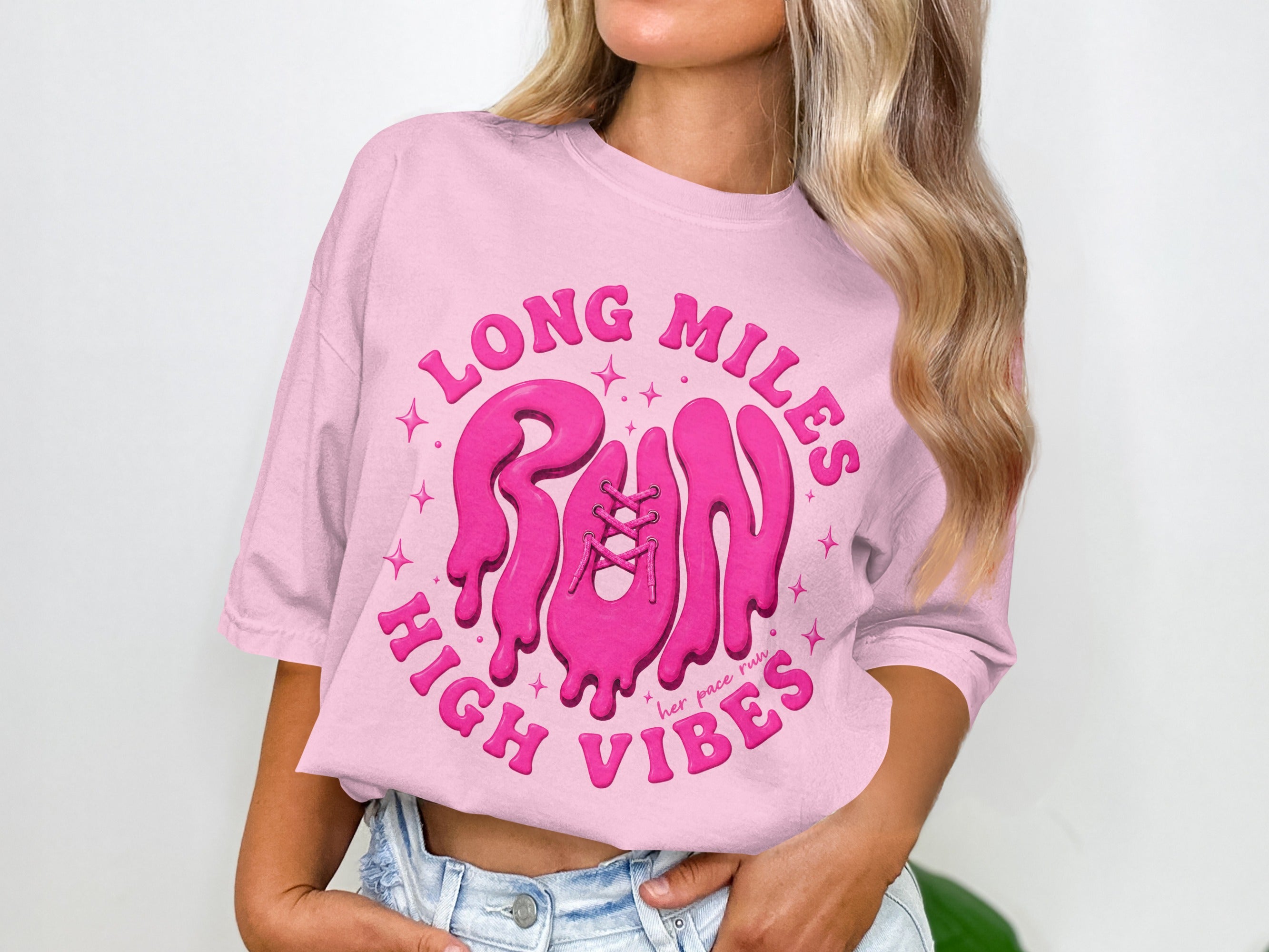 Pink t-shirt with "Long Miles, Run, High Vibes" text and a graphic of a running shoe.
