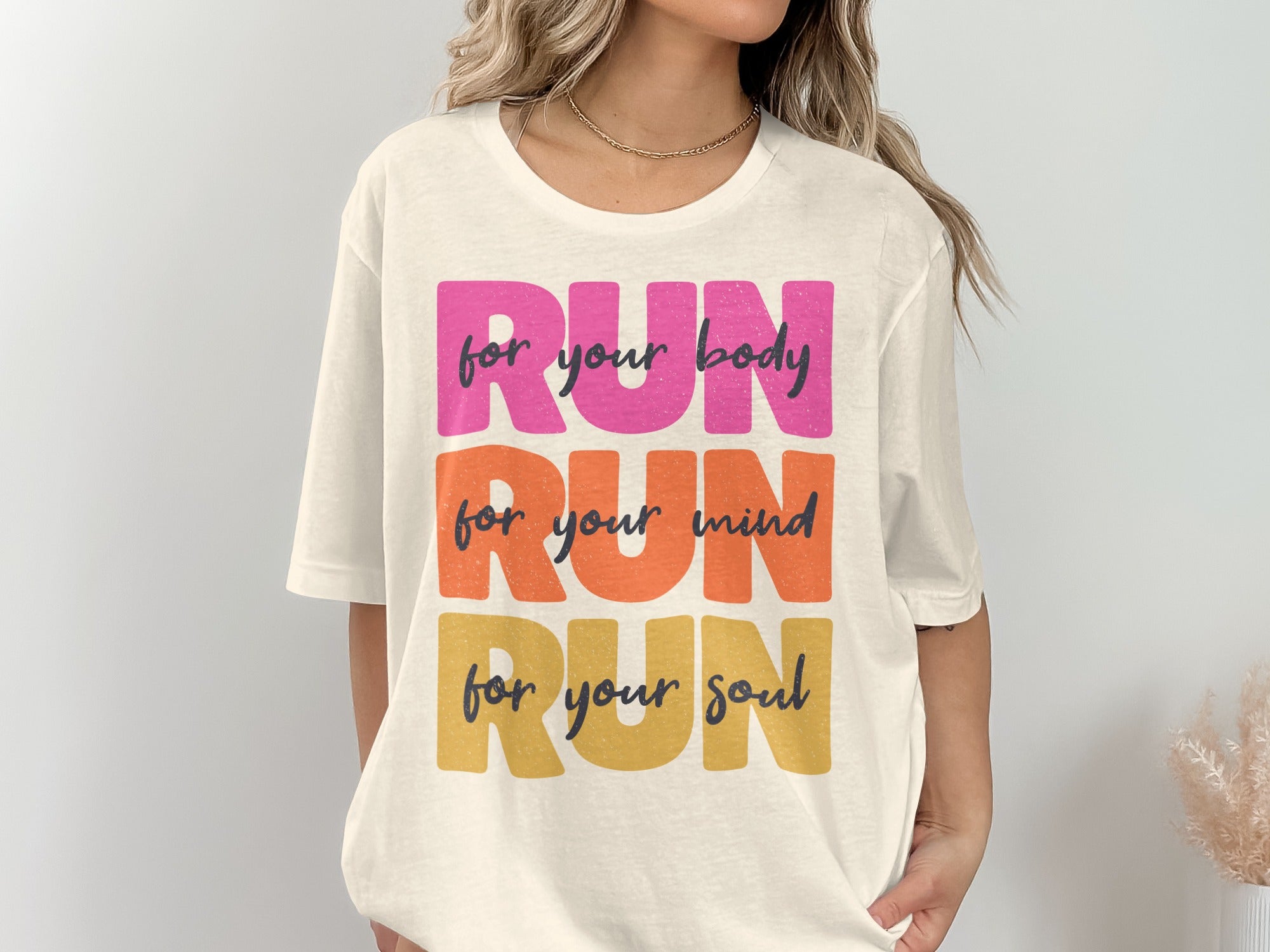 Cream t-shirt with stacked text: RUN for your body, RUN for your mind, RUN for your soul.