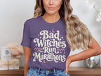 Purple t-shirt with "Bad Witches Run Marathons" text and moon graphics.