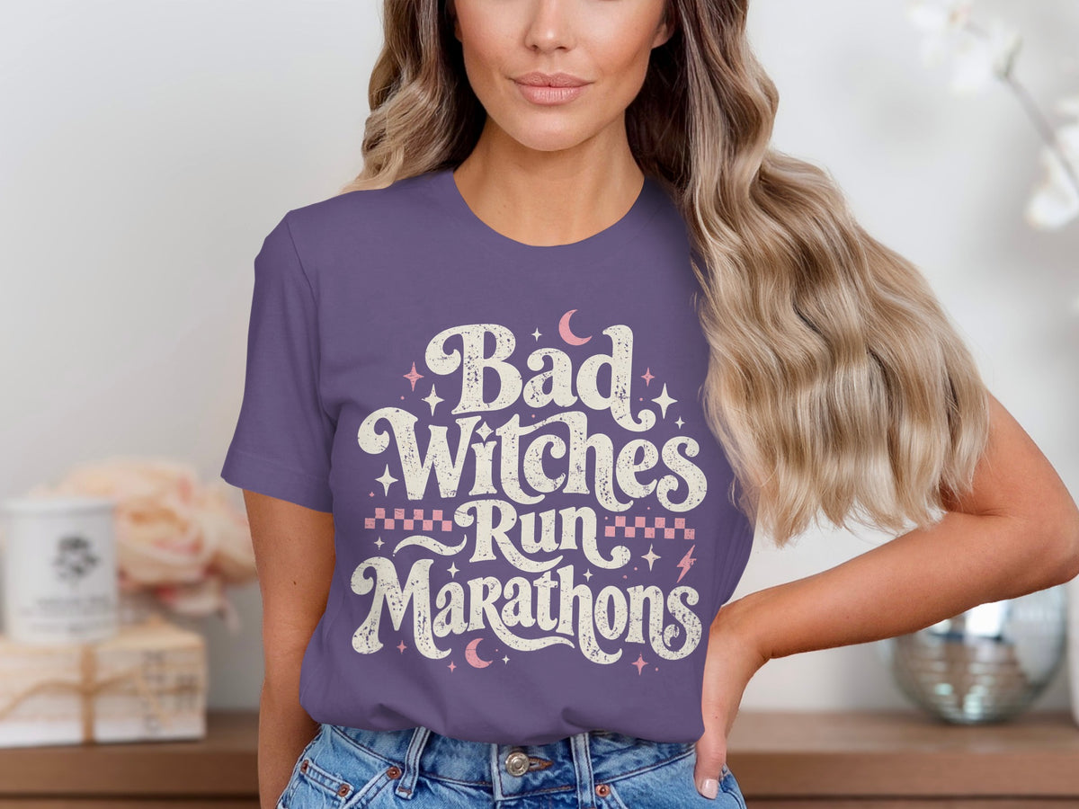 Purple t-shirt with "Bad Witches Run Marathons" text and moon graphics.