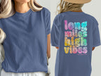 Blue t-shirt with tie-dye text "long miles high vibes her pace run."