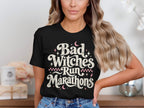 Black t-shirt with distressed text that reads "Bad Witches Run Marathons".