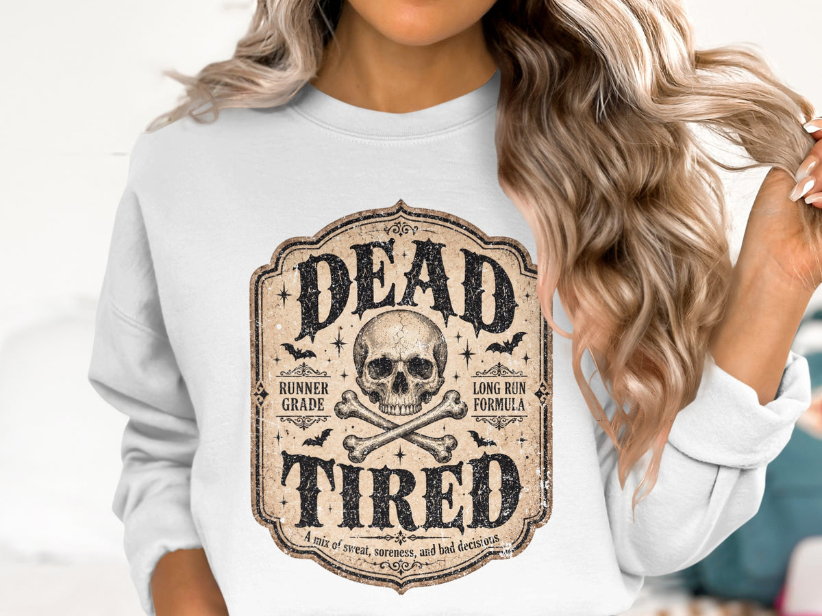 White sweatshirt with "DEAD TIRED" text, skull, crossbones, bats, and runner-themed phrases.