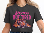 Dark grey t-shirt graphic with a tiger and "fierce BUT TIRED" text.