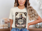 T-shirt with "Delusion Elixir" bottle graphic, "XVI. The Runner" and warning text.