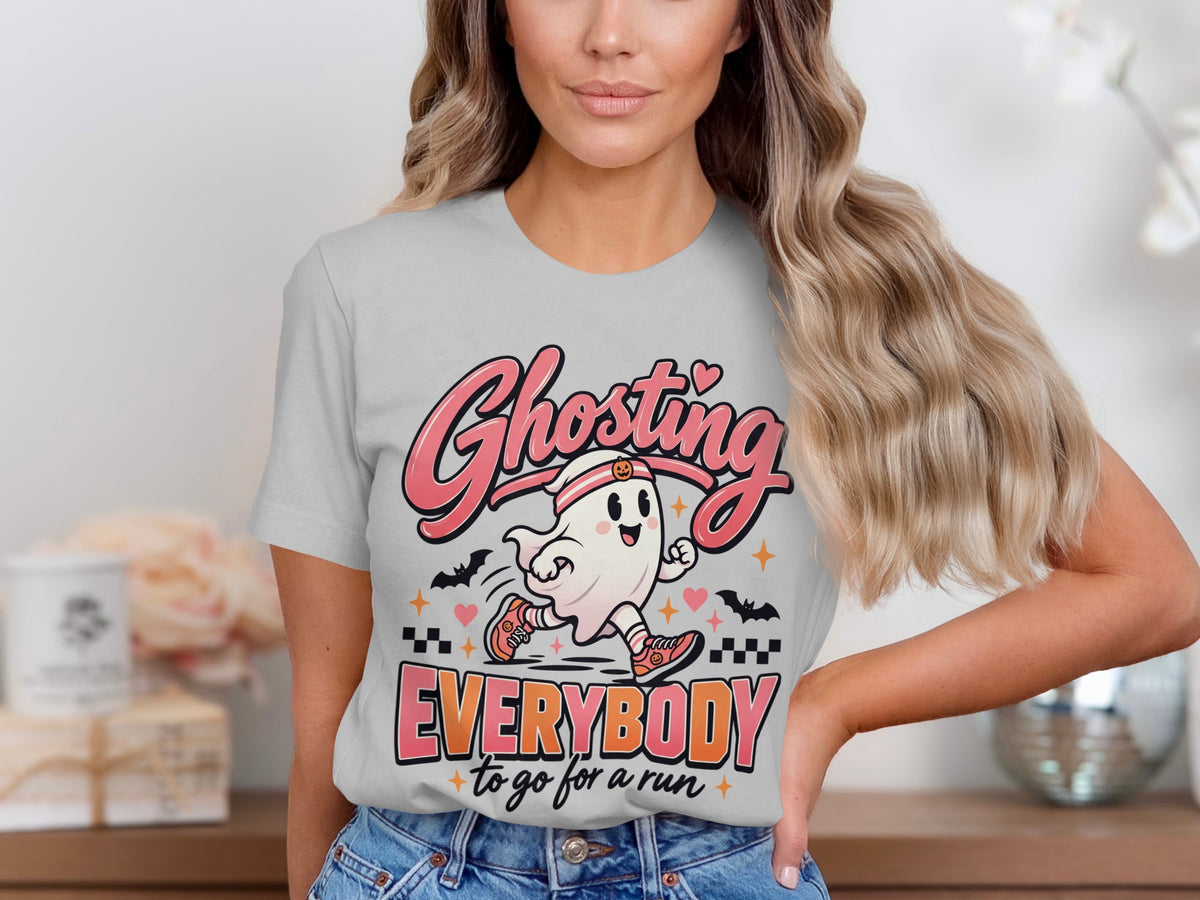 Ghosting Everybody to go for a run graphic on a light gray t-shirt.