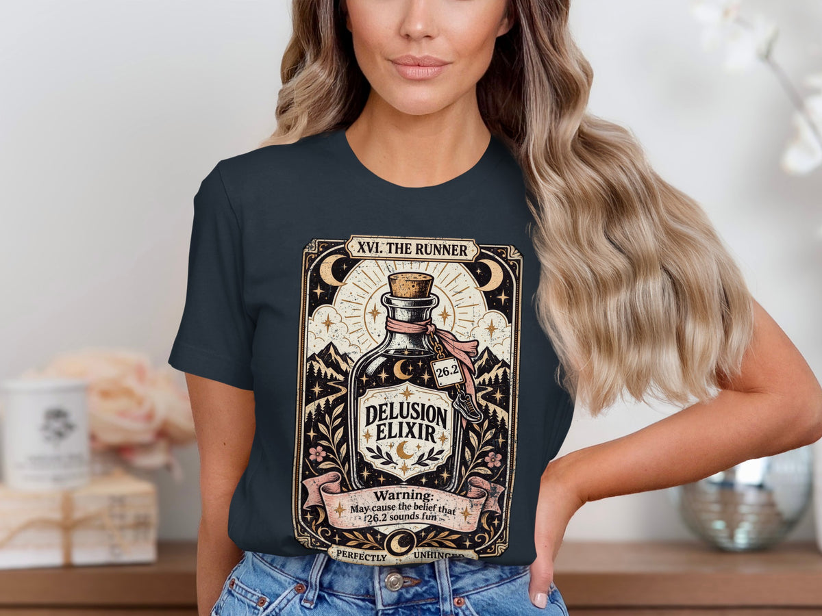 T-shirt graphic featuring "Delusion Elixir" bottle, mountains, stars, and marathon warning.
