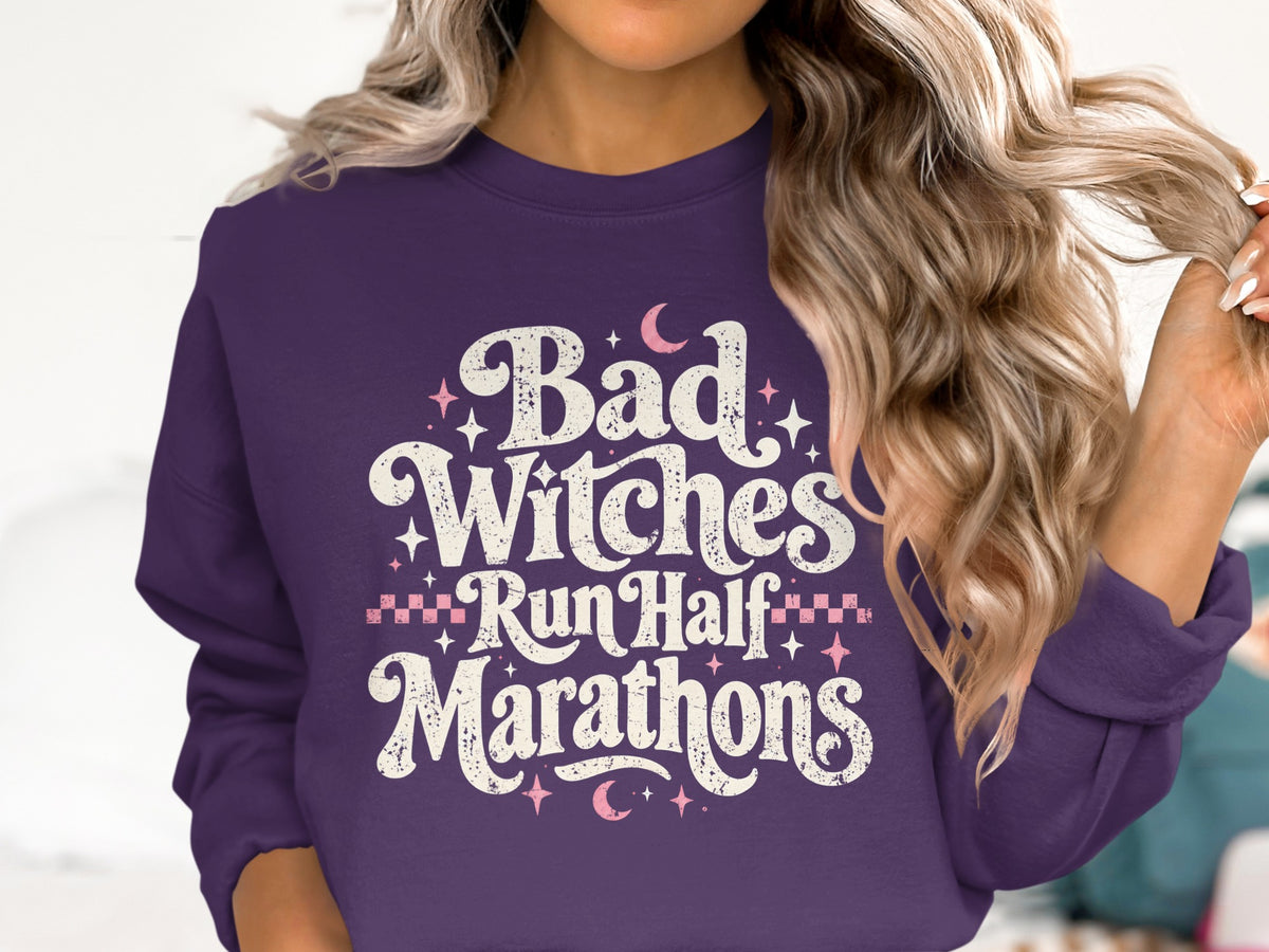 Purple sweatshirt with text "Bad Witches Run Half Marathons"