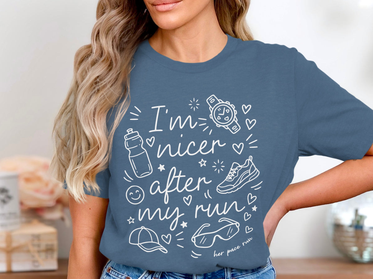 Blue t-shirt with white text and graphics reading "I'm nicer after my run"
