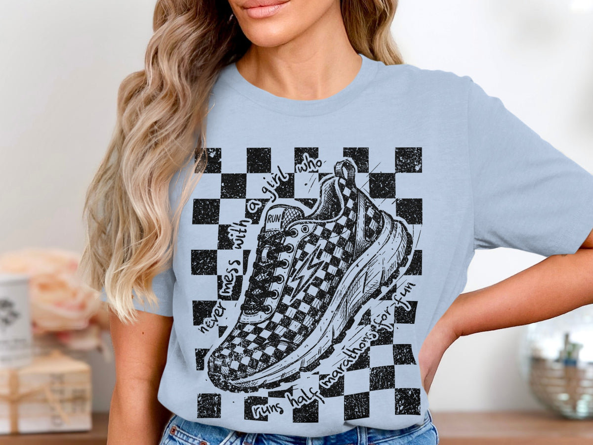 T-shirt with checkered pattern, running shoe graphic, and text.