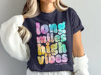 Navy t-shirt with tie-dye text: "long miles high vibes".