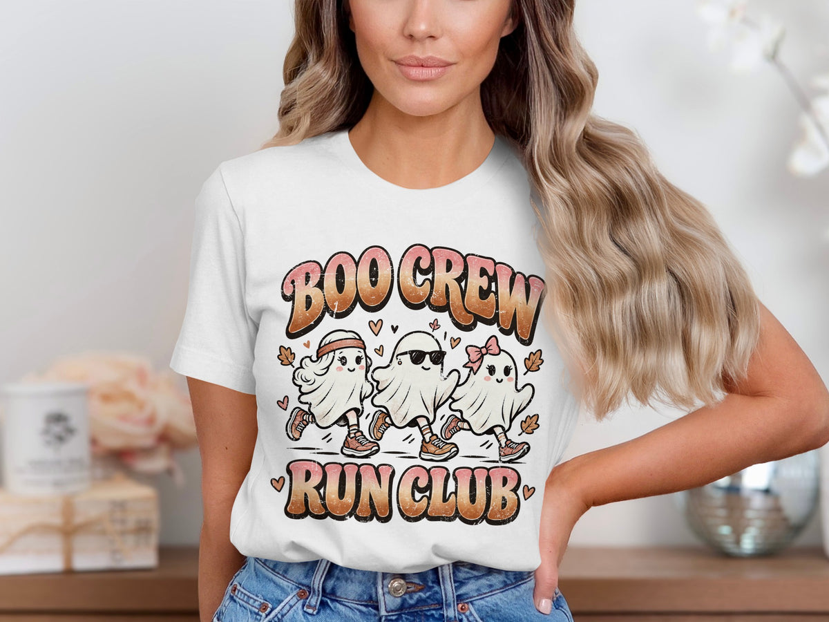 Three cartoon ghosts with text "BOO CREW RUN CLUB" on a white t-shirt.
