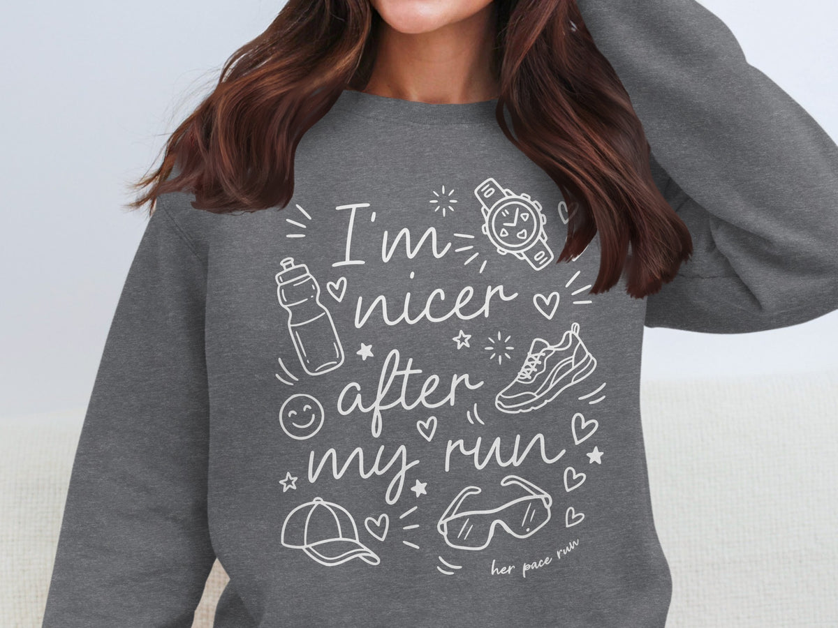Dark grey sweatshirt with "I'm nicer after my run" and running icons.